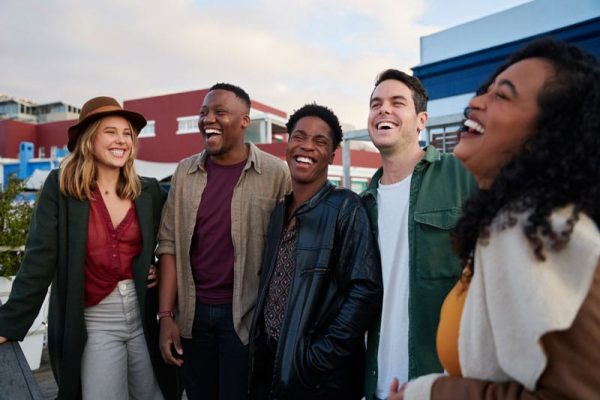 Group of young adults happy outside in their community